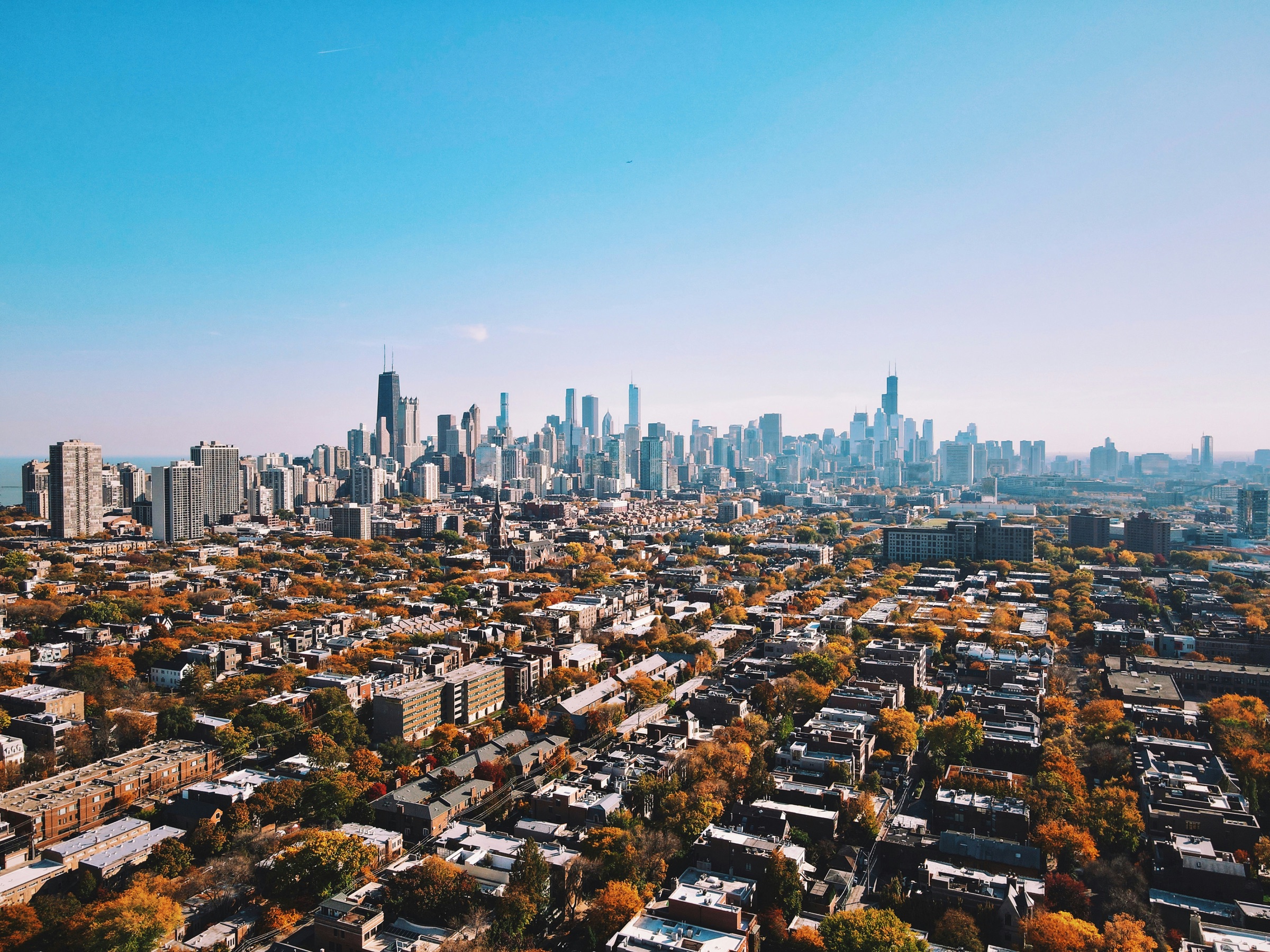 Aerial view of a city skyline under a clear blue sky